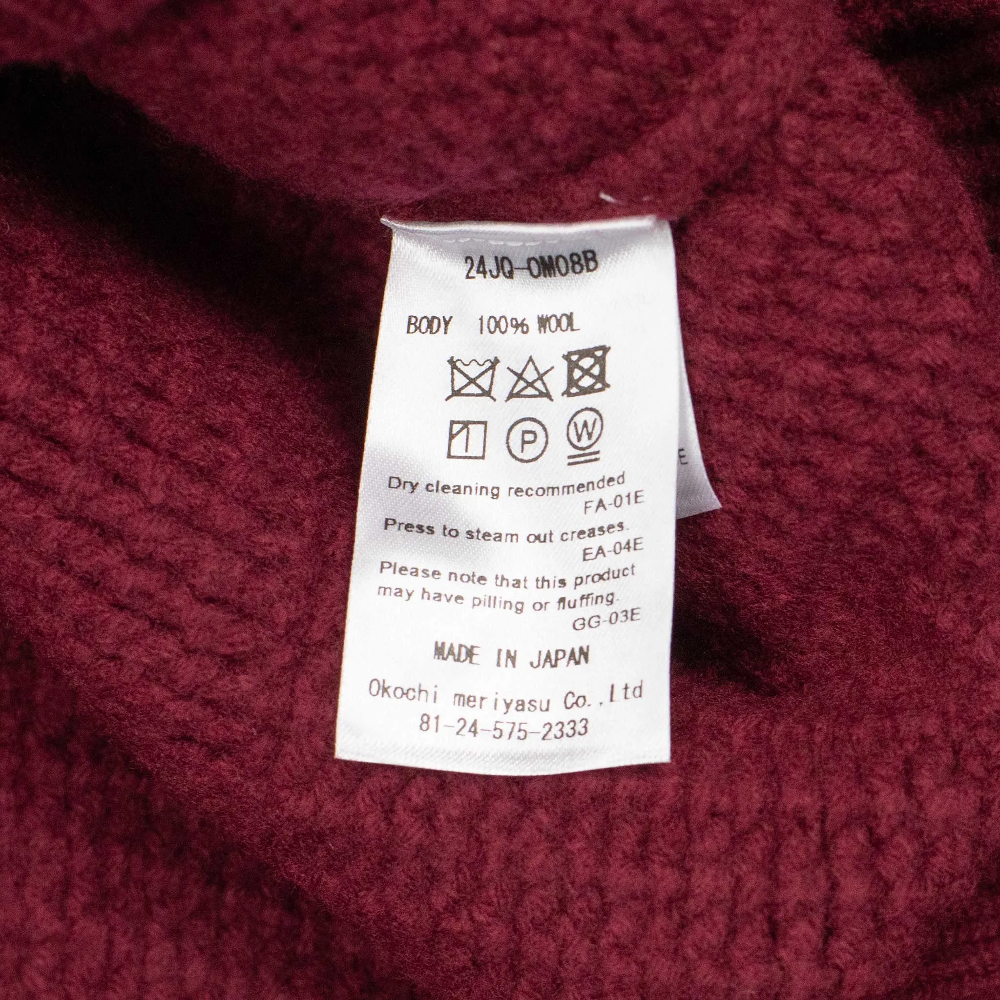 Basketweave mockneck sweater in brick red Merino wool